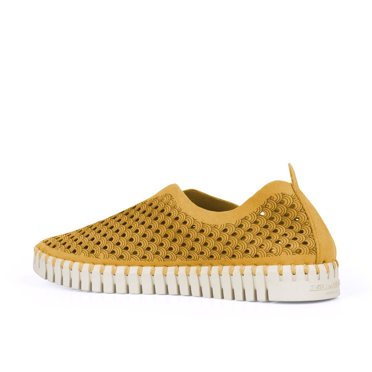 Mustard yellow Ilse Jacobsen slip-on shoe with a textured, perforated wave pattern and a cream-colored, ridged sole.