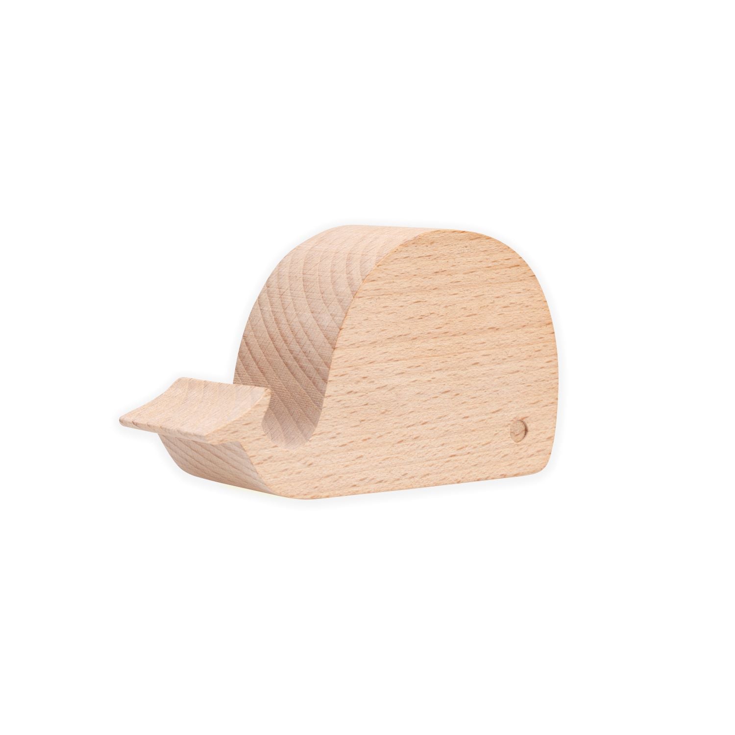 Light-colored wooden whale-shaped smartphone stand.
