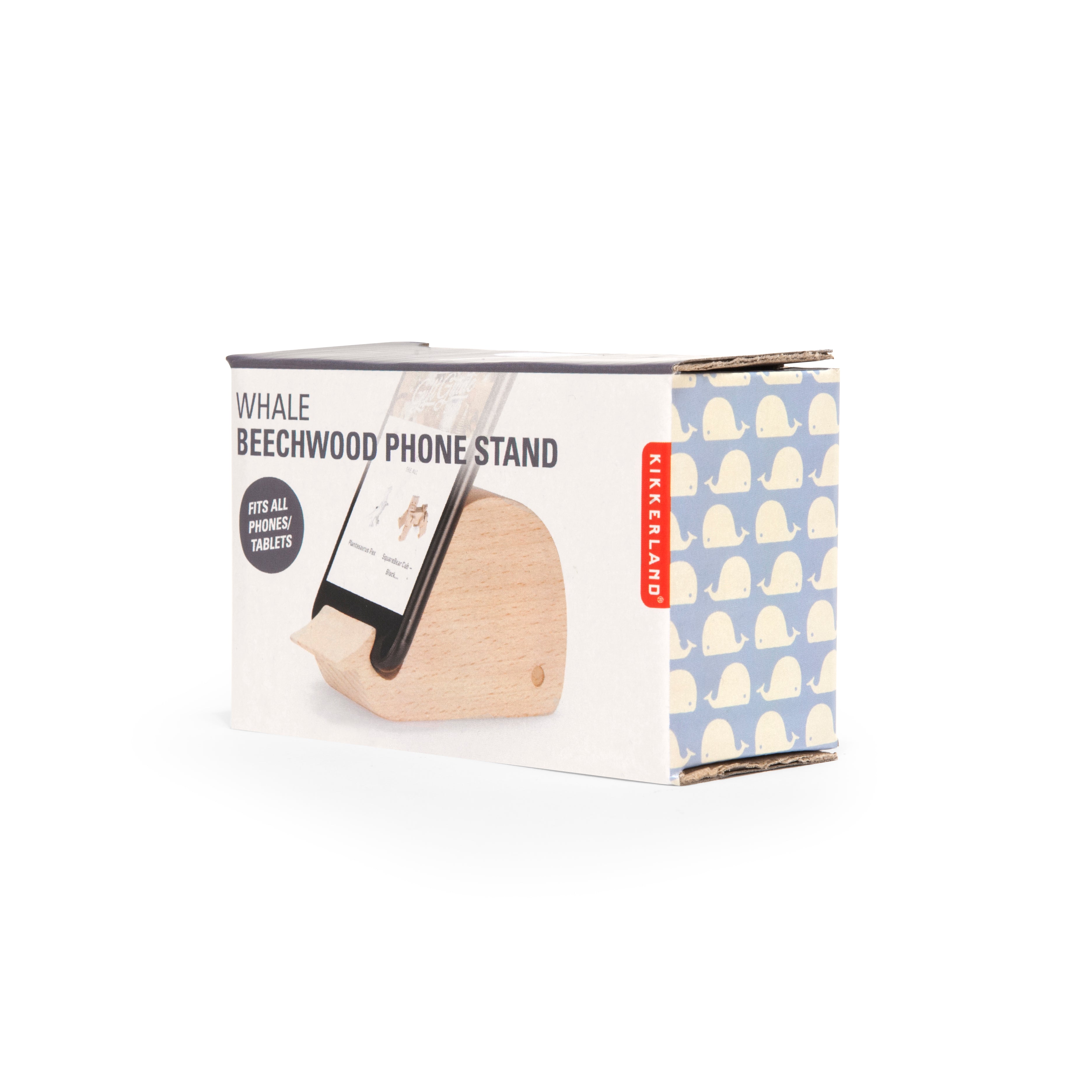 Wooden whale-shaped phone stand in its box.  The box features a whale pattern and indicates it fits phones and tablets.