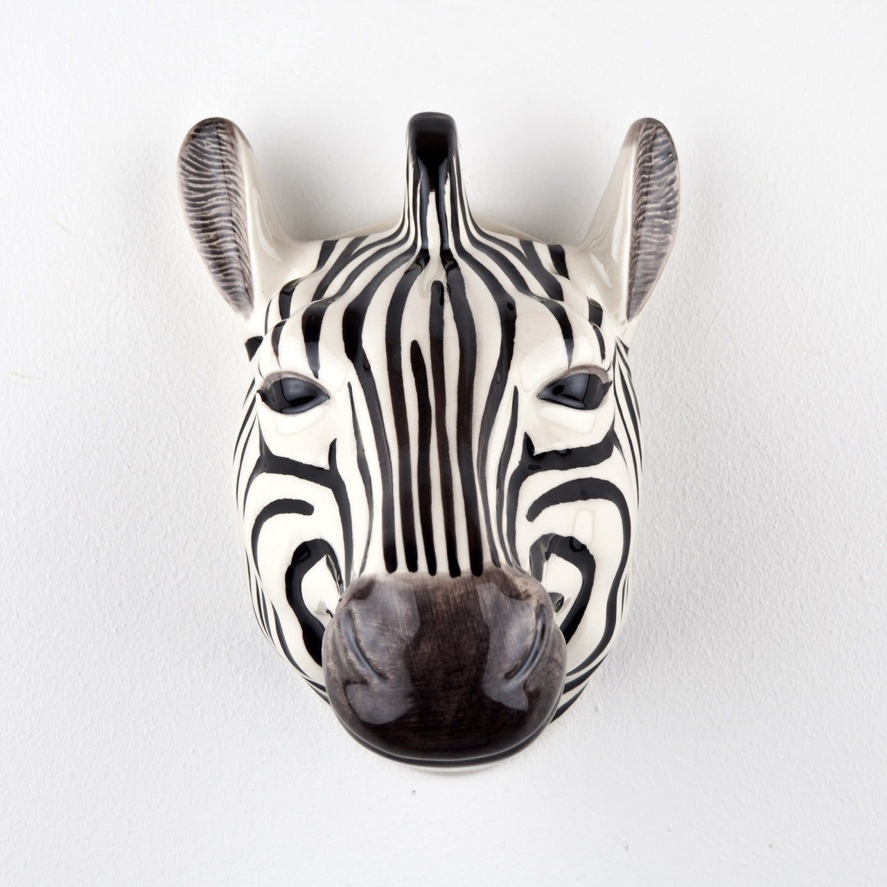 Ceramic zebra head wall hanging. Black and white stripes, glossy finish.