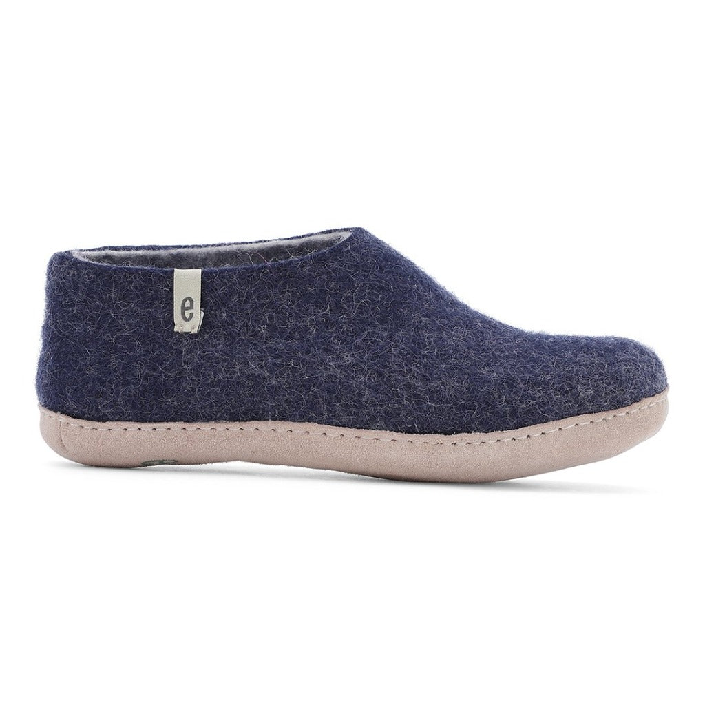 Navy blue wool slipper with a light pink sole.  Small logo on the side.