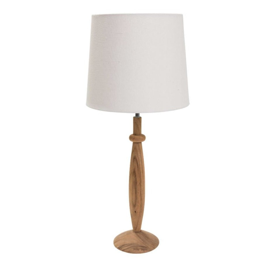 Wooden table lamp with a cylindrical off-white shade.  The base features a turned wood design.