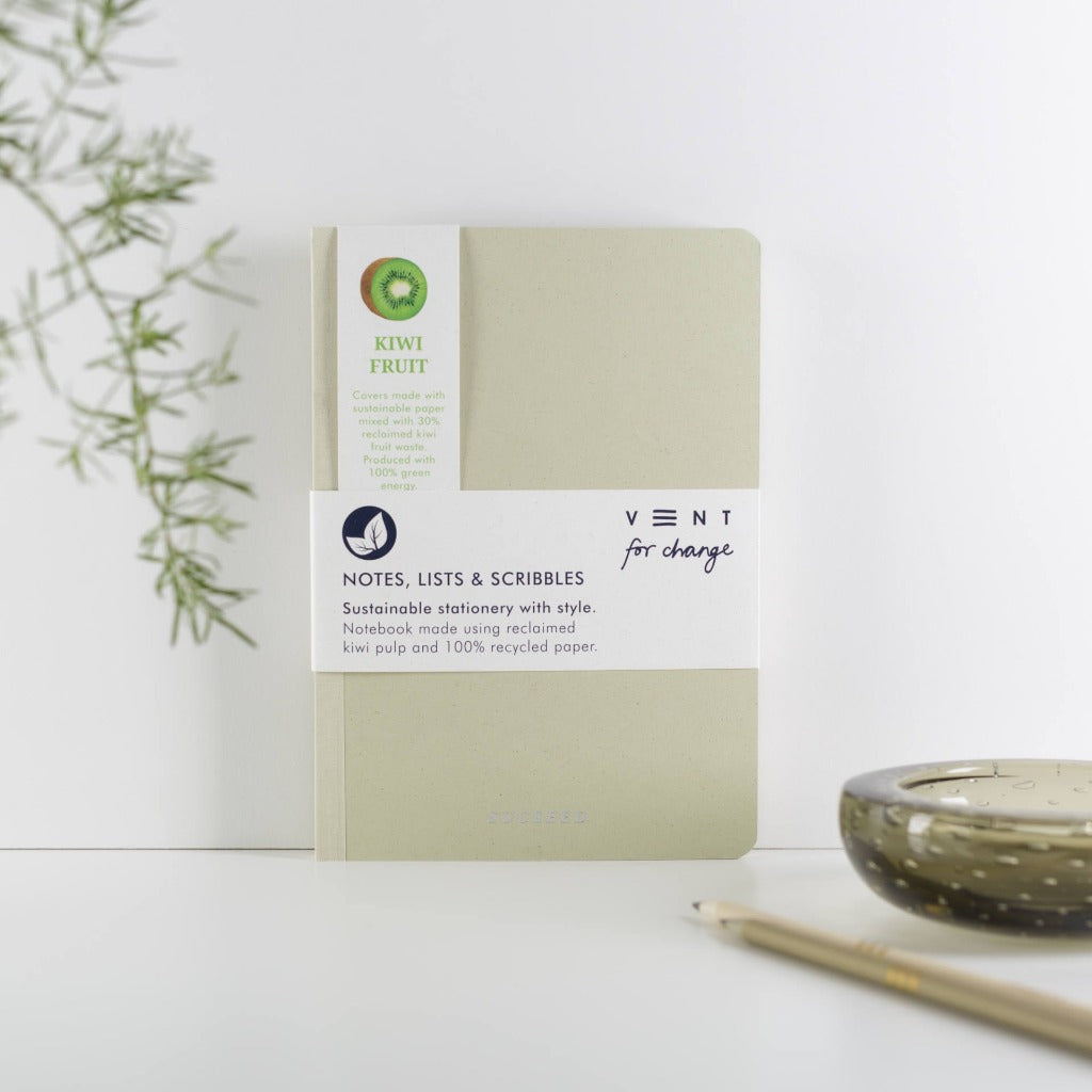 Light beige notebook made with reclaimed kiwi pulp and recycled paper;  "Kiwi Fruit" and "Vent for change" branding.
