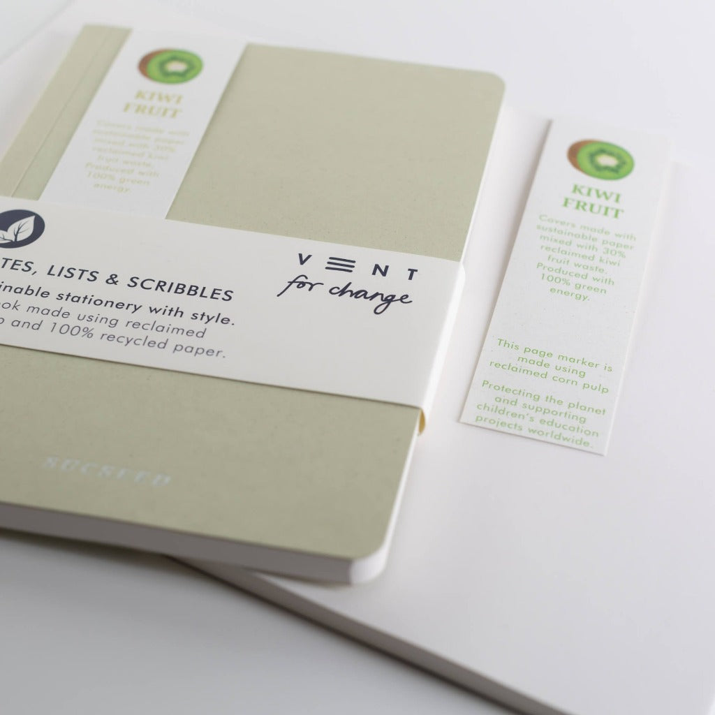 Light green notebook with "VENT for change" label; made with reclaimed and recycled paper; includes a kiwi fruit-themed