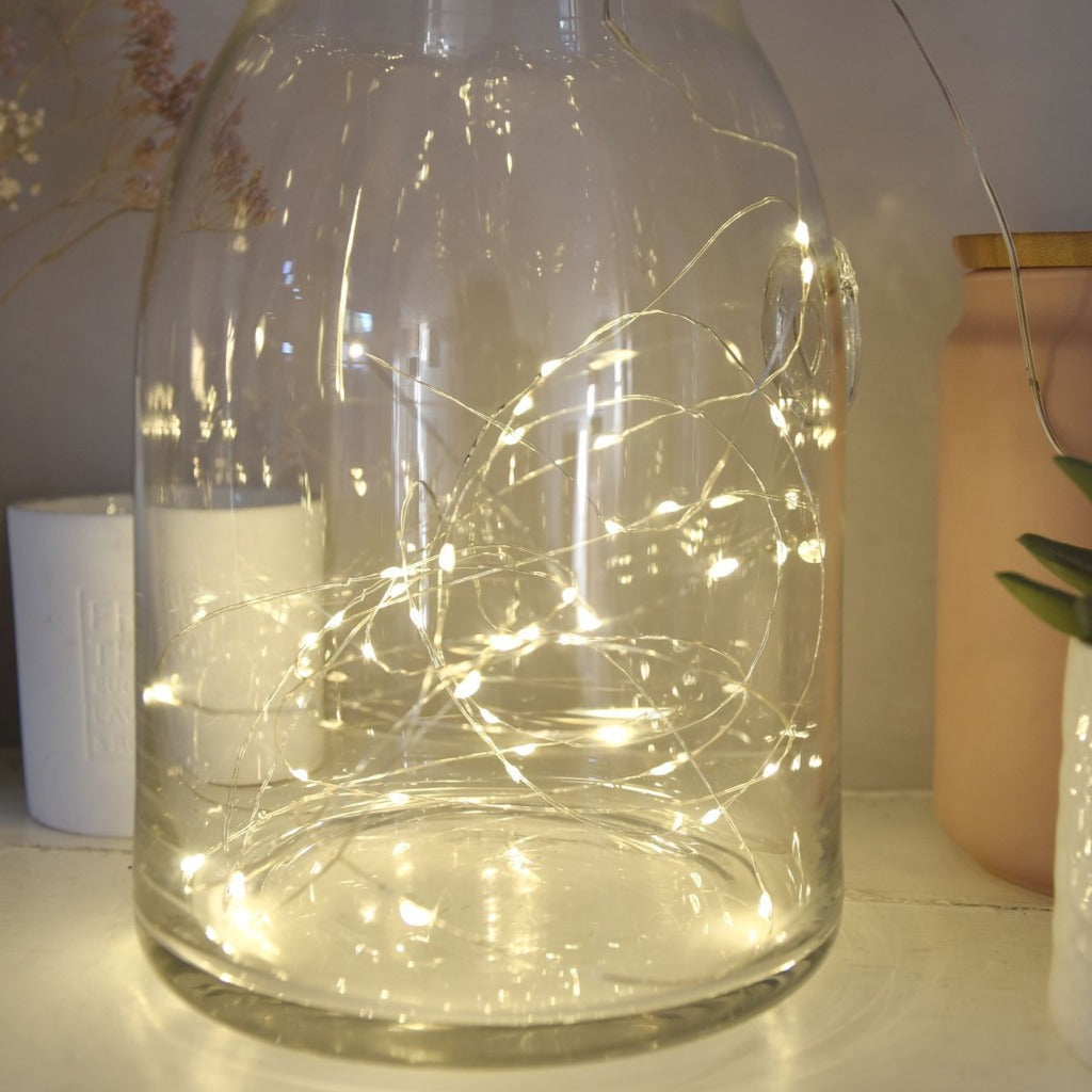 Glass jar containing warm white LED fairy lights.