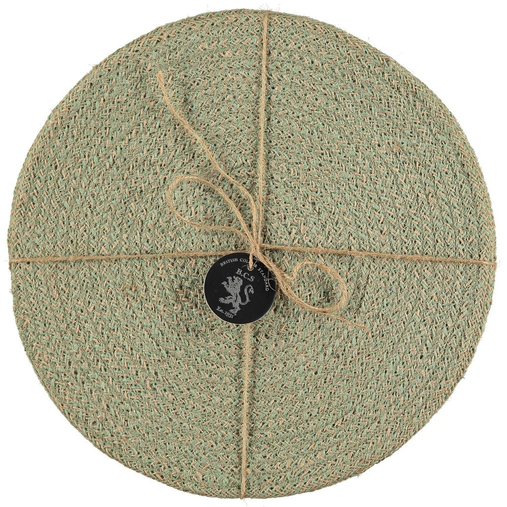 Round placemat, sage green, textured woven design, tied with twine.