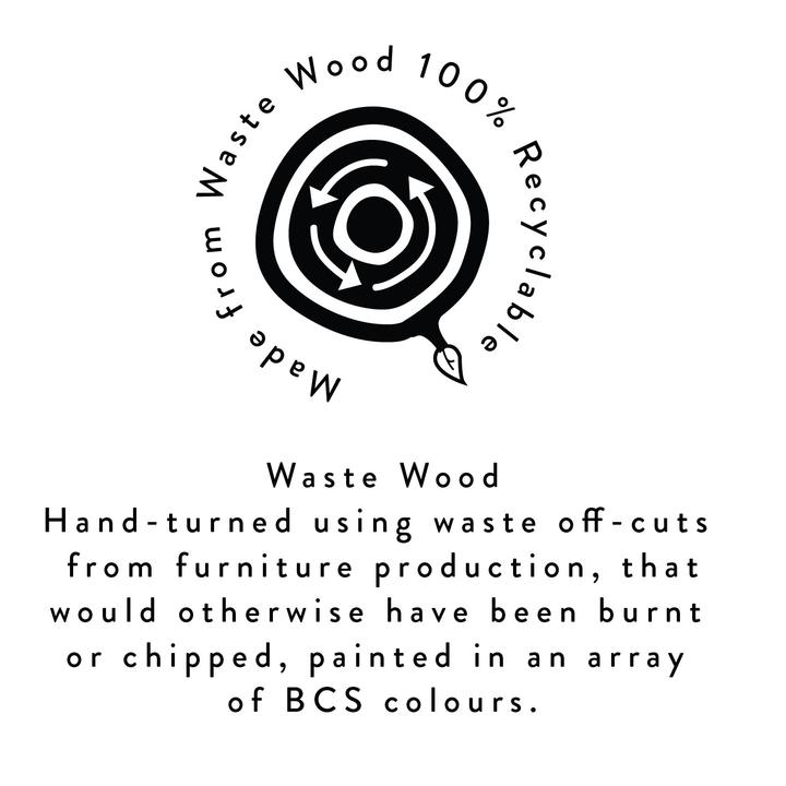 ‘Made from Waste Wood’ logo and statement, which reads, ‘Waste Wood, Hand-turned using waste off-cuts from furniture production, that would otherwise have been burnt or chipped, painted in an array of BCS colours.’