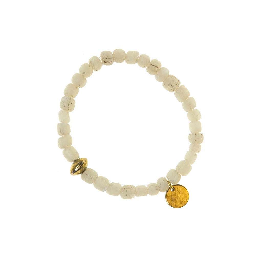 Off-white beaded bracelet with gold accents; a small gold bead and a circular charm.