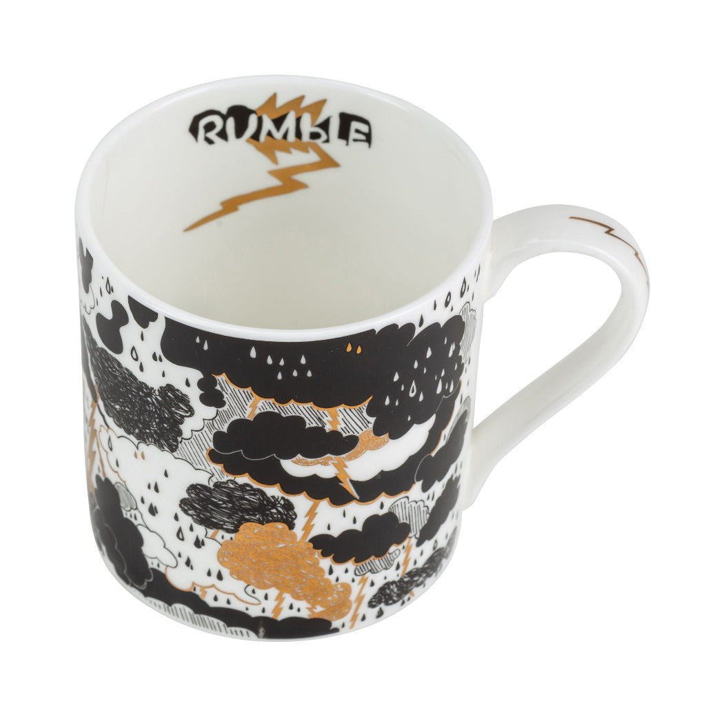 White mug with black and gold storm cloud design; "Rumble" and lightning bolt inside.