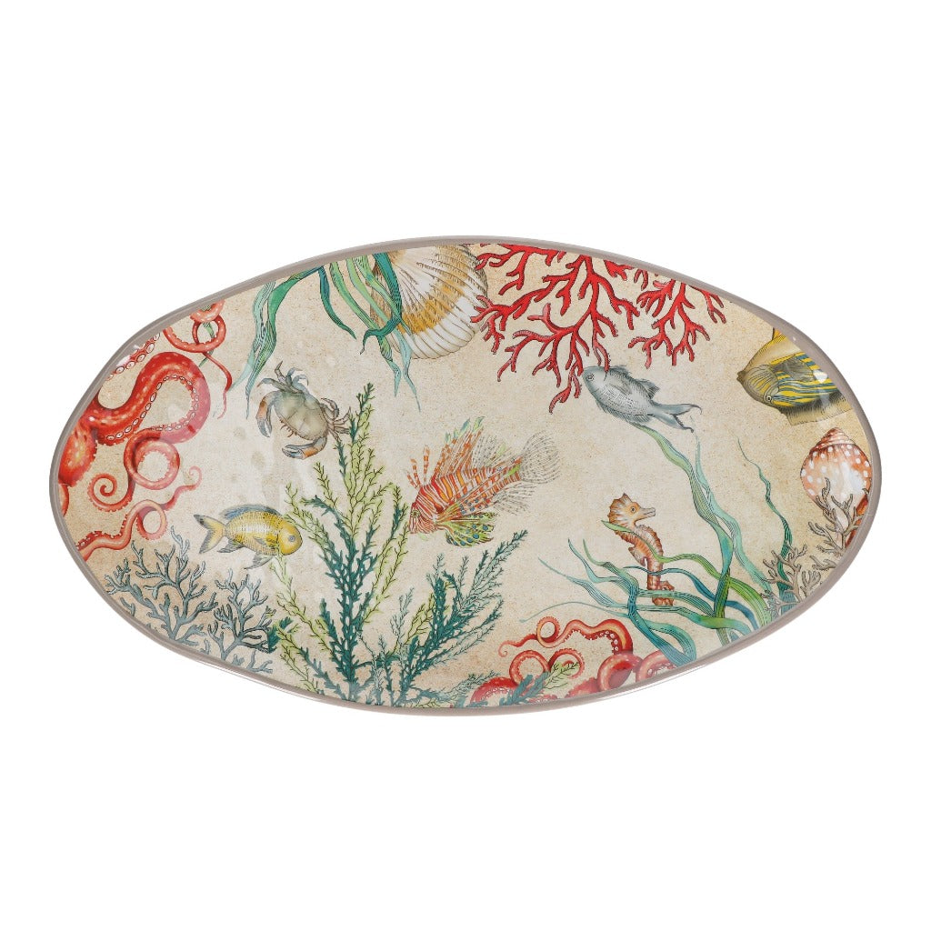 Oval serving platter with a beige background featuring a colorful illustration of various sea creatures, including fish,