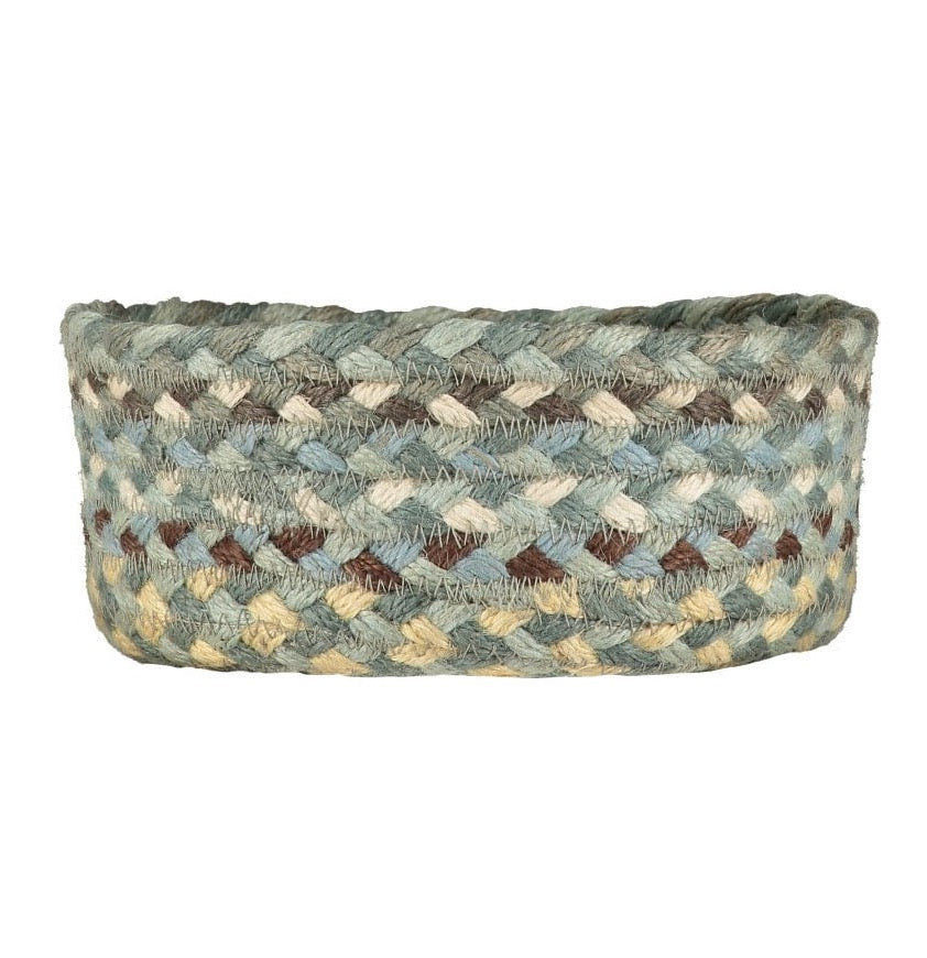 Oval braided jute basket in teal, beige, and brown.