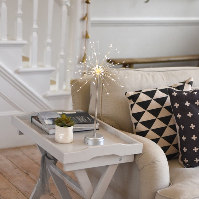LED firework tabletop light with a silver metal base and numerous thin wires radiating outwards, creating a sparkling effect.