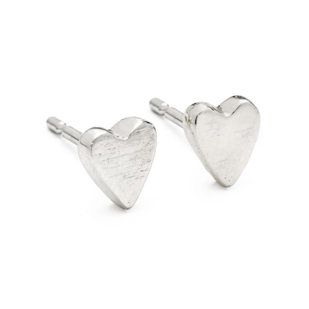 Pair of small, brushed silver heart-shaped stud earrings.